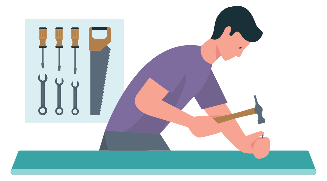 man slaat een spijker met een hamer